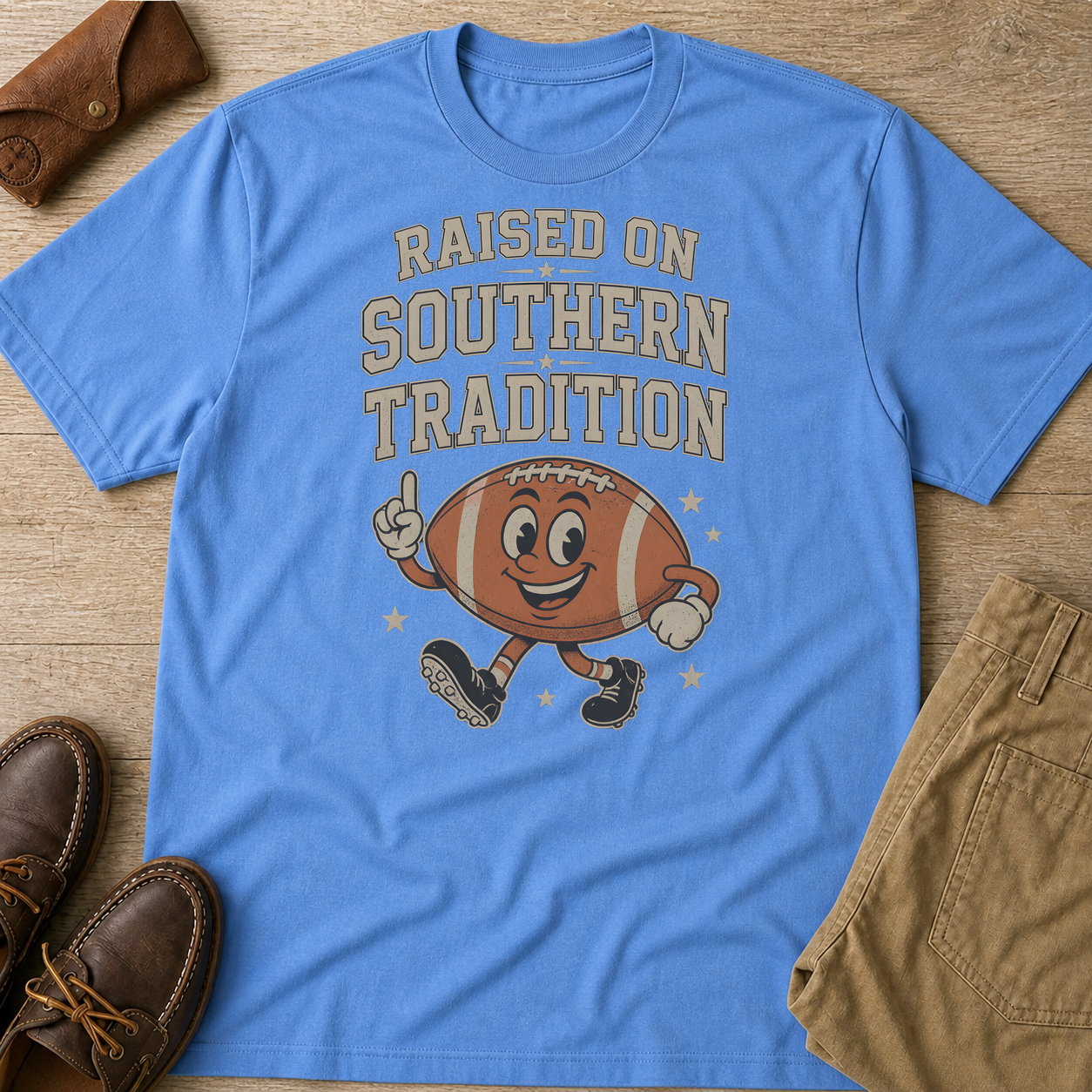 Raised On Southern Tradition Football Fan T-Shirt Carolina Blue t-shirt flat lay mockup