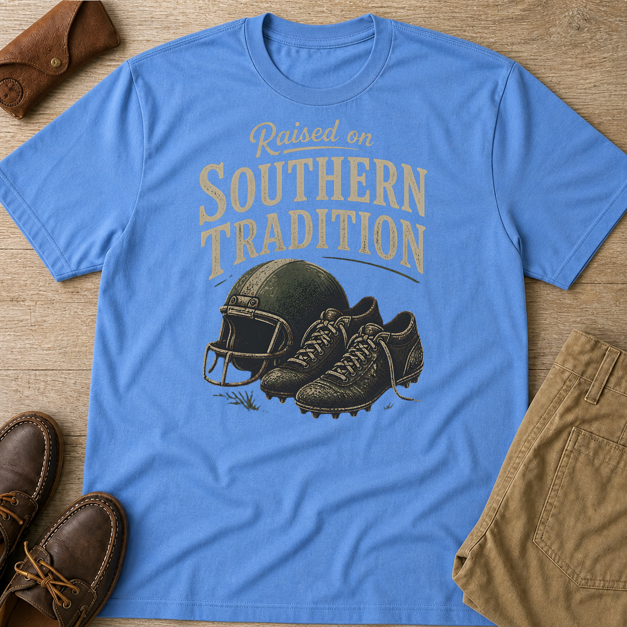 Raised On Southern Tradition Football Helmet Cleats T-Shirt Carolina Blue t-shirt flat lay mockup